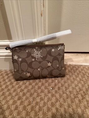 Coach Brown Signature Canvas Wristlet with Silver Star and Snowflake Accents